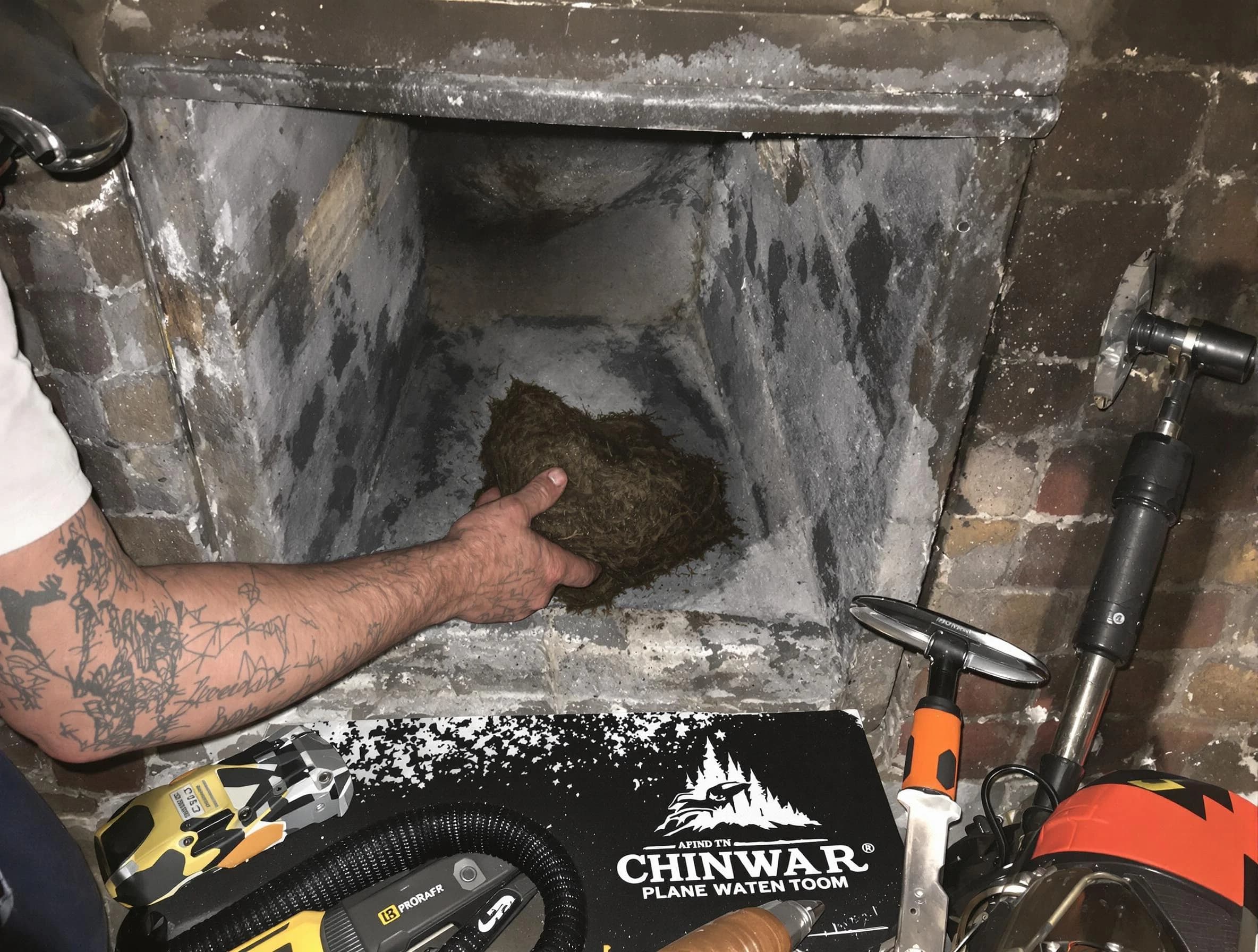 Dumbarton Chimney Sweep safely removing debris and screening chimney in Dumbarton, VA